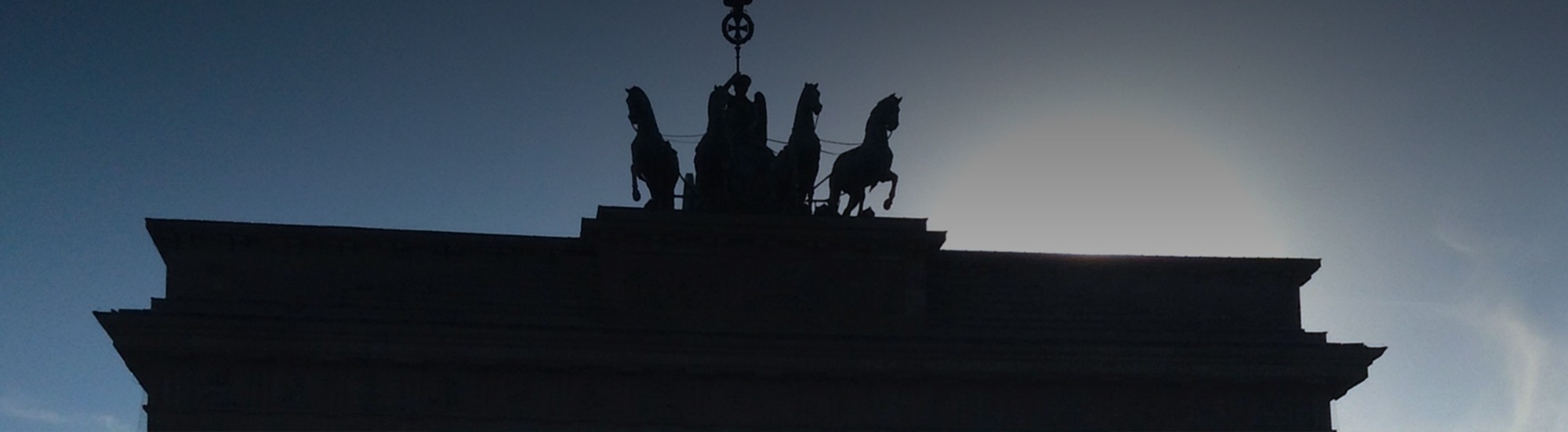 Silhouette of the Brandenburg Gate at dusk